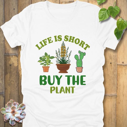 White t-shirt featuring the design Life is short, buy the plant printed in green text with plant illustration